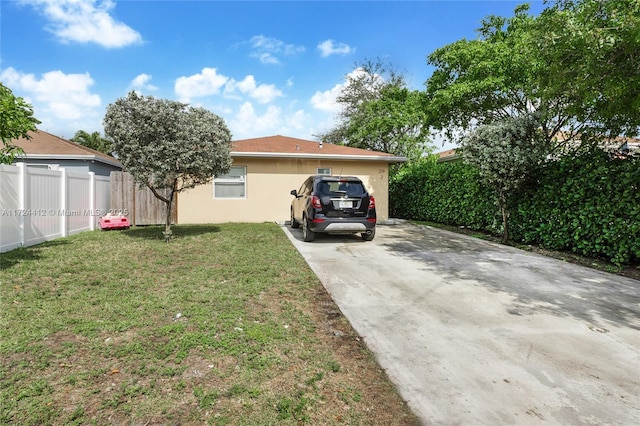 view of side of home featuring a yard