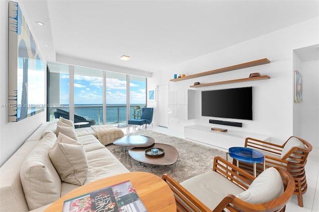 living room featuring floor to ceiling windows