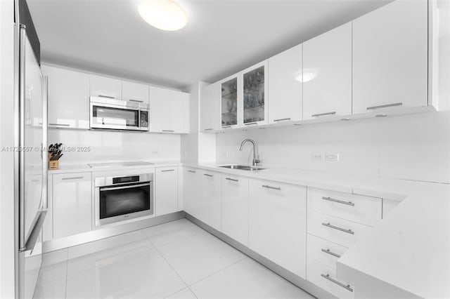 kitchen with stainless steel appliances and white cabinetry