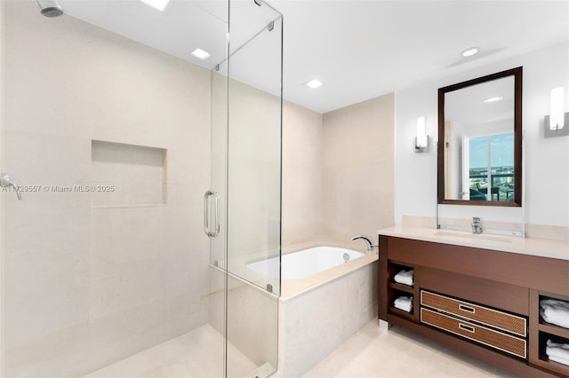 bathroom featuring vanity and plus walk in shower