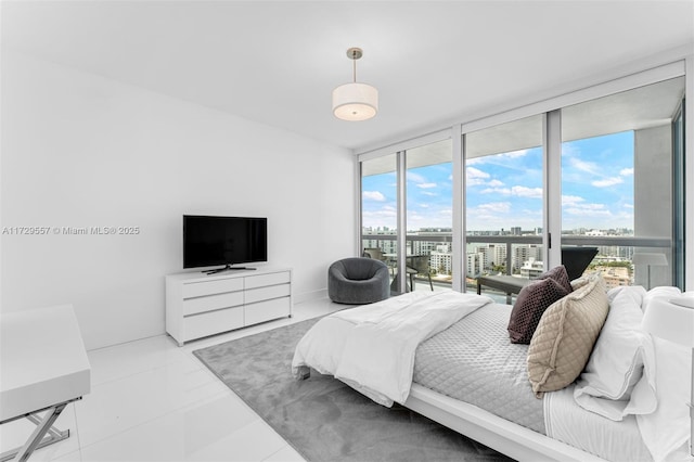 tiled bedroom featuring floor to ceiling windows and access to exterior