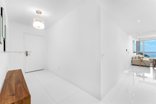 corridor featuring light tile patterned floors