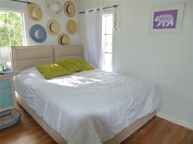 bedroom featuring dark hardwood / wood-style flooring