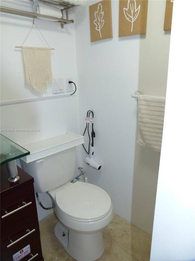 bathroom featuring tile patterned floors and toilet