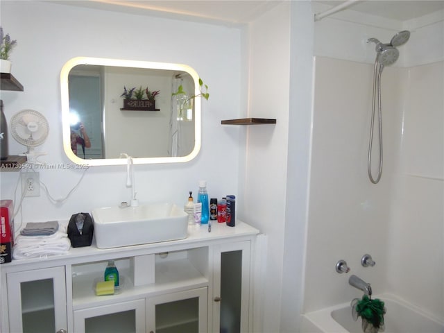 bathroom with vanity and bathtub / shower combination