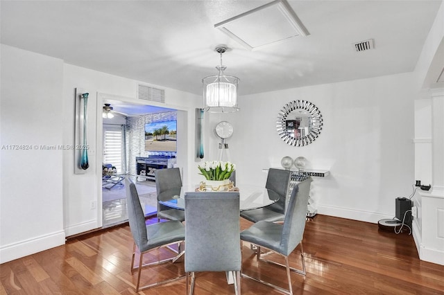 dining area with hardwood / wood-style flooring