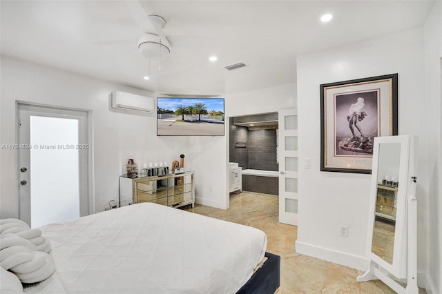 tiled bedroom with connected bathroom, ceiling fan, and an AC wall unit