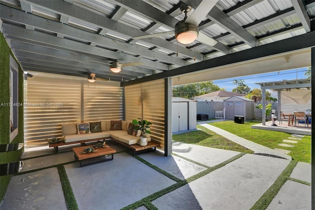 view of patio / terrace featuring an outdoor living space, a pergola, and a shed