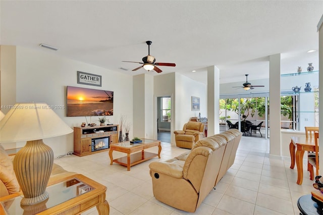 tiled living room featuring a fireplace