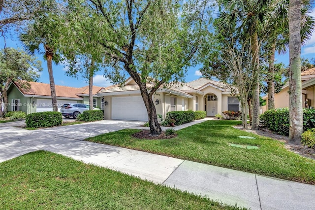 single story home featuring a garage and a front lawn