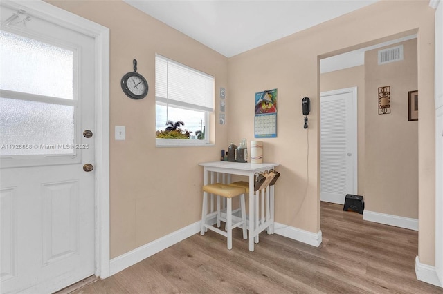 foyer with light hardwood / wood-style floors