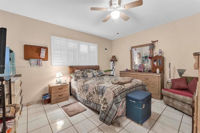 bedroom featuring light tile patterned floors and ceiling fan