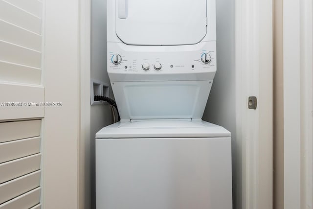 laundry area featuring stacked washer and dryer