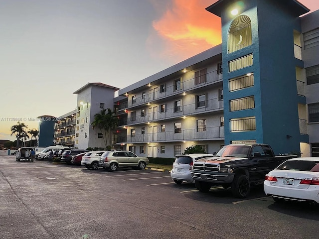 view of outdoor building at dusk