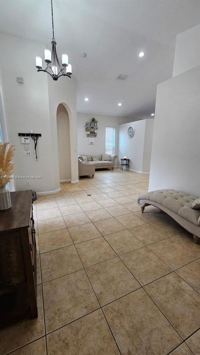 interior space with a chandelier and light tile patterned flooring