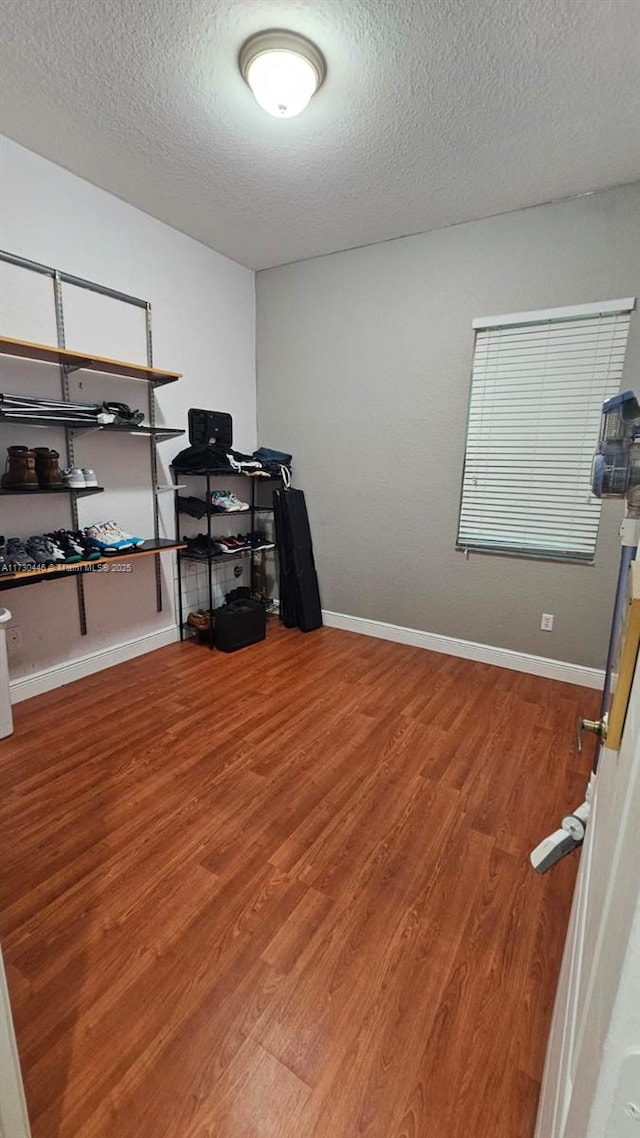 office space with hardwood / wood-style flooring and a textured ceiling