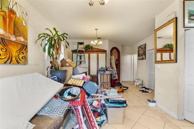 interior space featuring light tile patterned flooring and an inviting chandelier