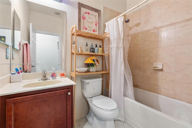 full bathroom with shower / bath combo with shower curtain, toilet, and vanity