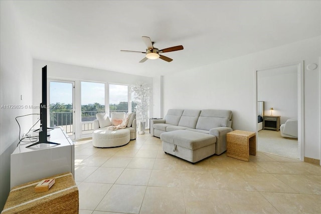 tiled living room with ceiling fan