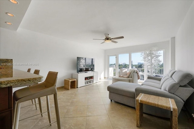 living room with light tile patterned floors and ceiling fan