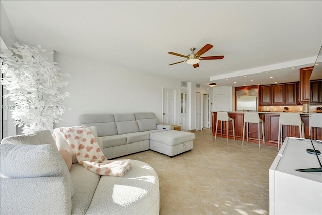 living room with ceiling fan