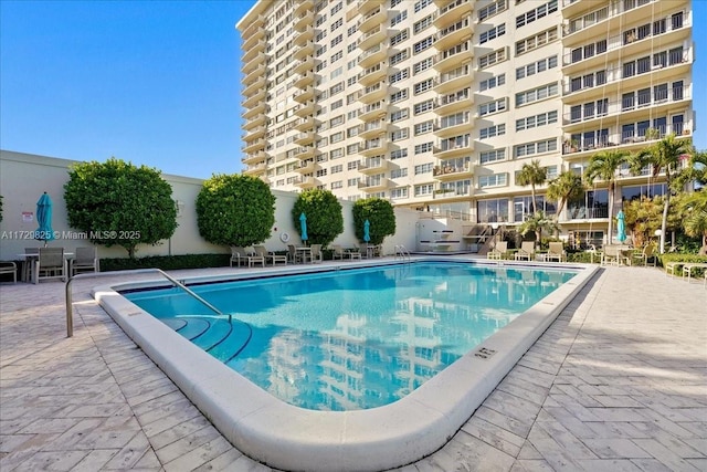 view of swimming pool with a patio area