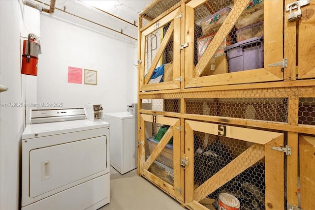 clothes washing area featuring washer and dryer