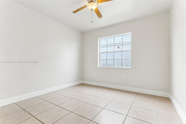 tiled empty room featuring ceiling fan