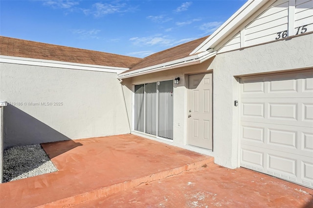 view of patio with a garage