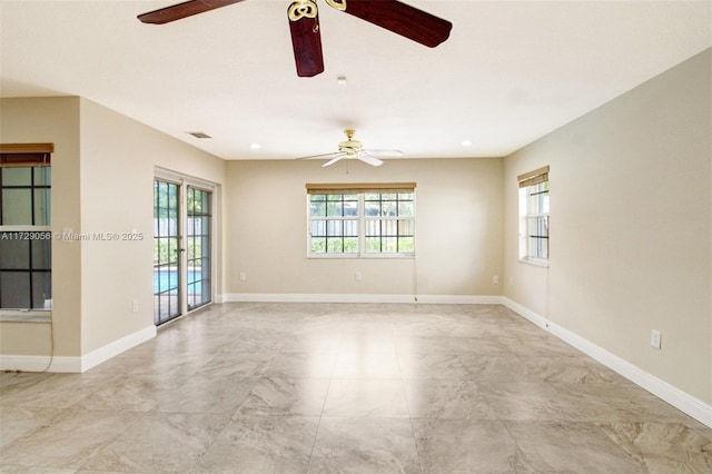 empty room with recessed lighting, visible vents, baseboards, and a ceiling fan