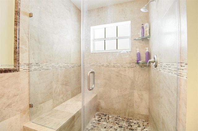 full bathroom featuring a stall shower