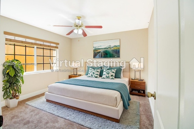 bedroom featuring ceiling fan, carpet flooring, and baseboards