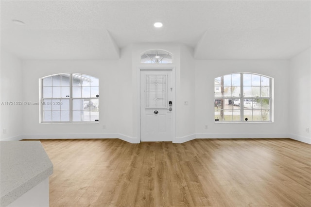 entryway with light hardwood / wood-style floors