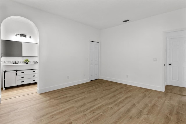 unfurnished bedroom with light hardwood / wood-style floors