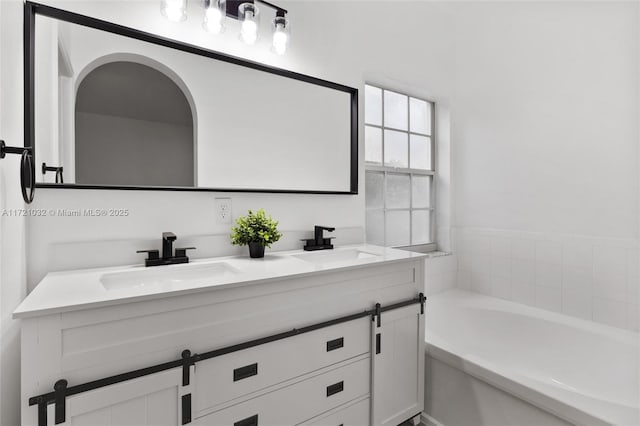 bathroom with vanity and a bathing tub