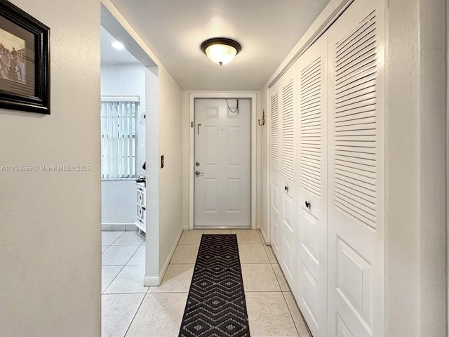 doorway featuring light tile patterned floors