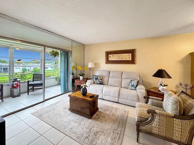 living room with light tile patterned floors and a textured ceiling