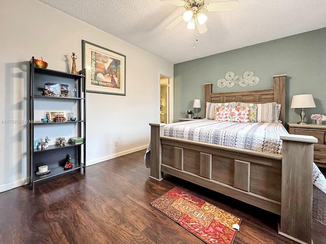 bedroom featuring ceiling fan, dark wood-type flooring, and a textured ceiling