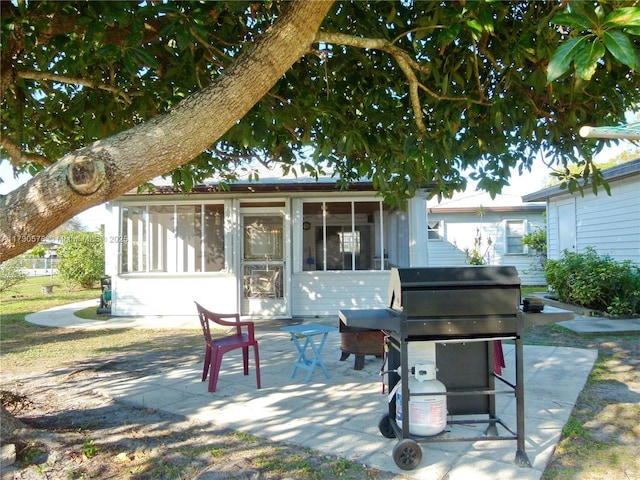 view of patio featuring a sunroom