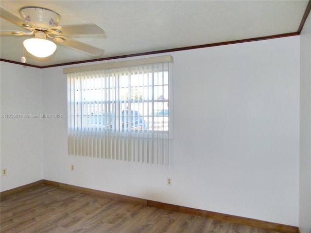 unfurnished room with crown molding, hardwood / wood-style floors, and ceiling fan