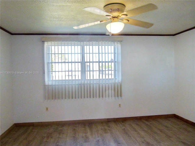 unfurnished room featuring crown molding, ceiling fan, and hardwood / wood-style floors