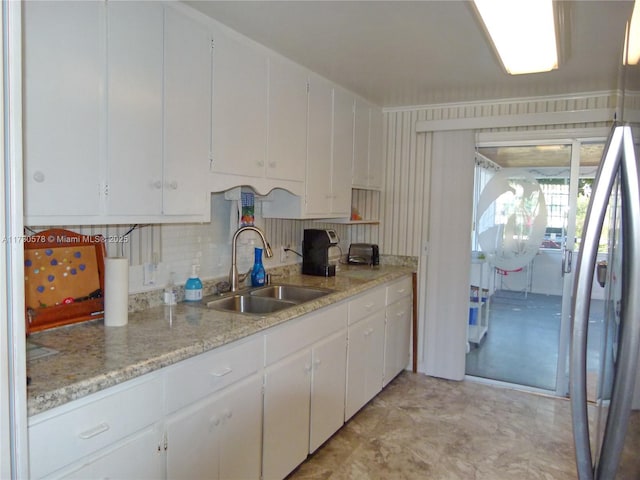 kitchen with sink and white cabinets