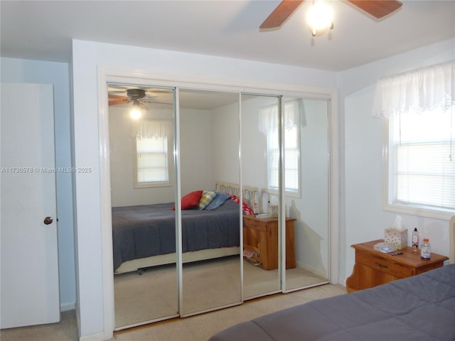 carpeted bedroom featuring ceiling fan