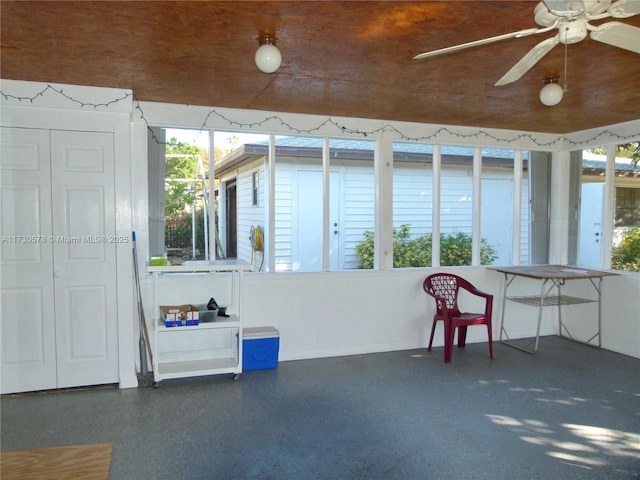 exterior space featuring wooden ceiling and ceiling fan