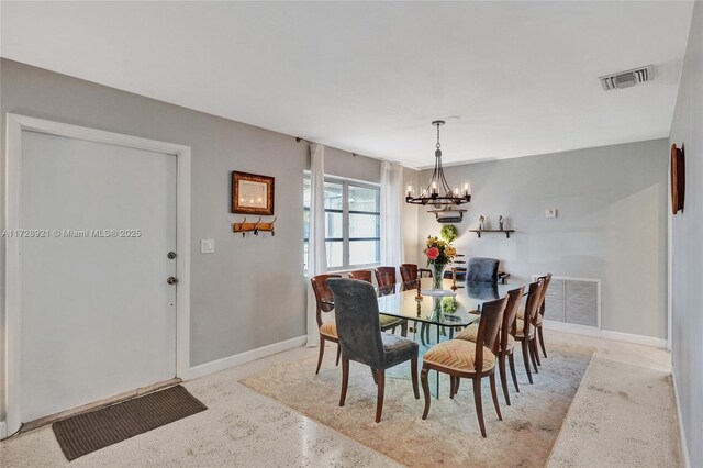 dining area featuring a chandelier