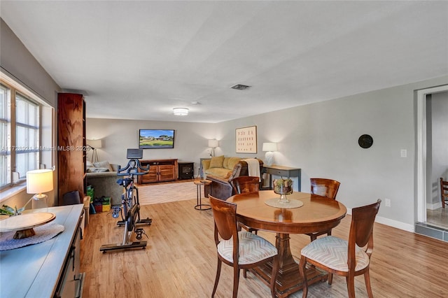 dining room with light hardwood / wood-style flooring