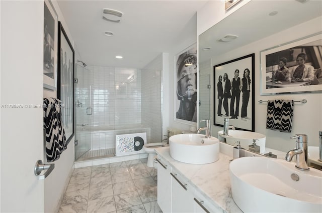 bathroom featuring vanity, toilet, and an enclosed shower