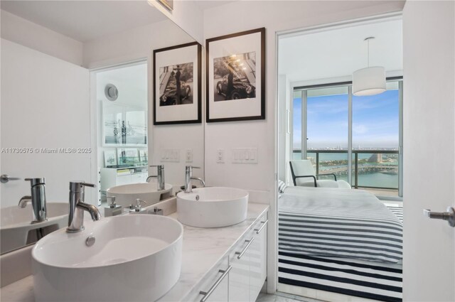 bathroom with vanity and a water view