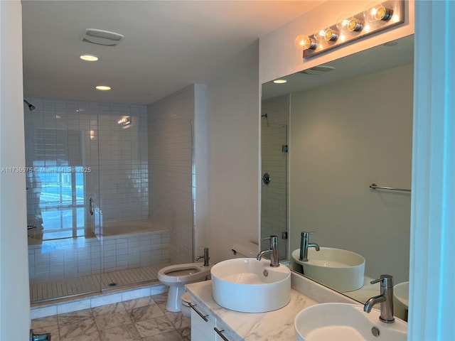 bathroom with a bidet, vanity, and a shower with door