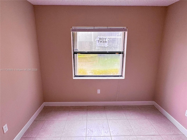 view of tiled spare room